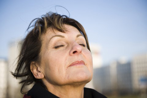 woman taking deep breath