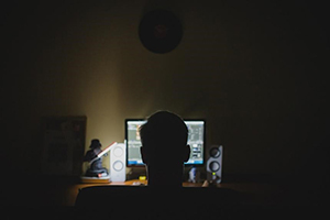 man looking at computer